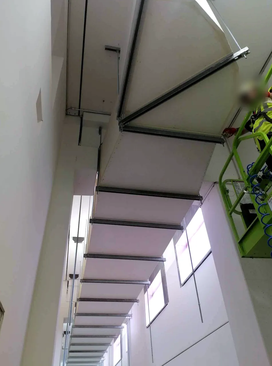 PROMAT fire-rated ductwork installed at high level along a technical corridor