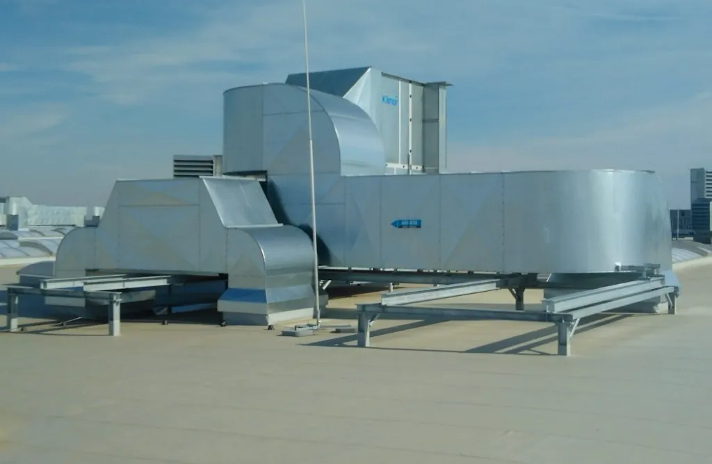 Galvanized ventilation ductwork and sound attenuator installed on a rooftop